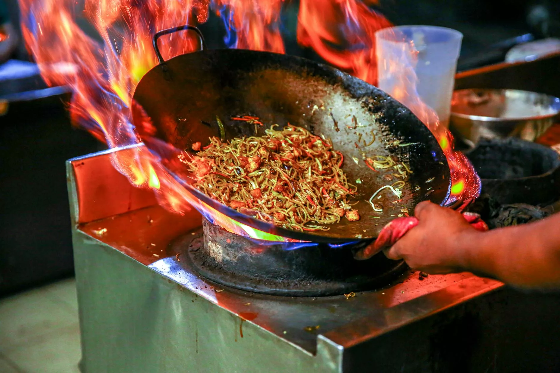 person cooking noodles