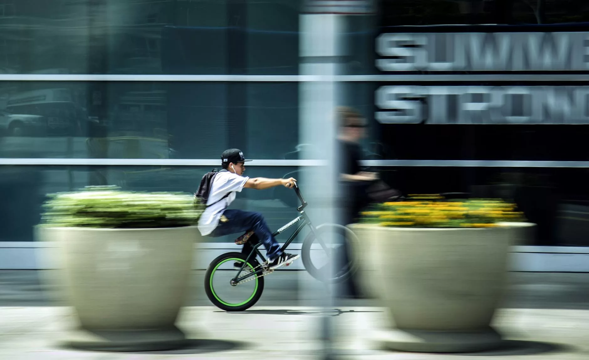 man riding bicycle in city